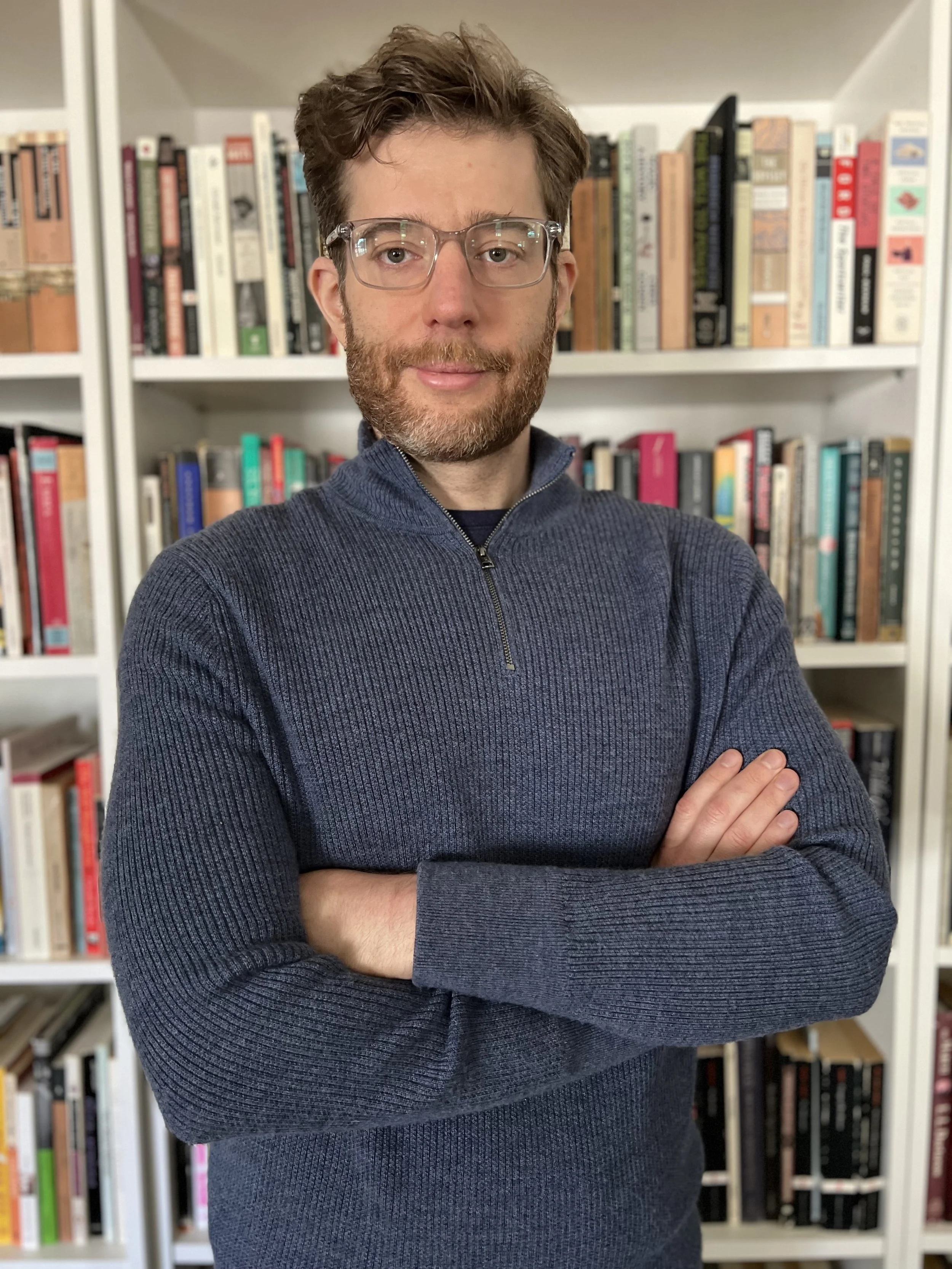 Dr. Gabriel Mehlman standing in front of a bookshelf